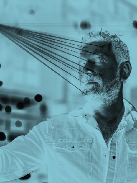 Man using mobile phone for facial recognition.